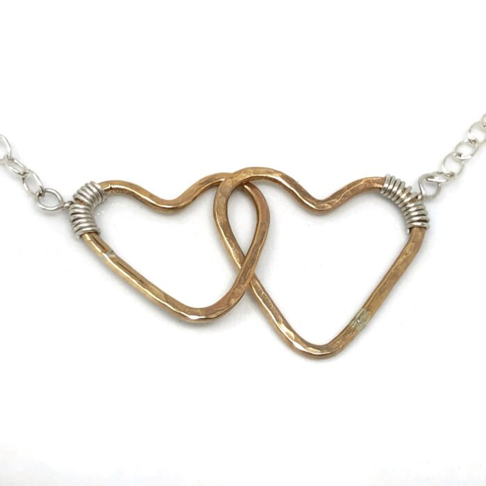 Connecting hearts in gold and silver