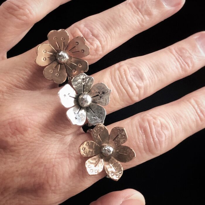 flower rings on hand